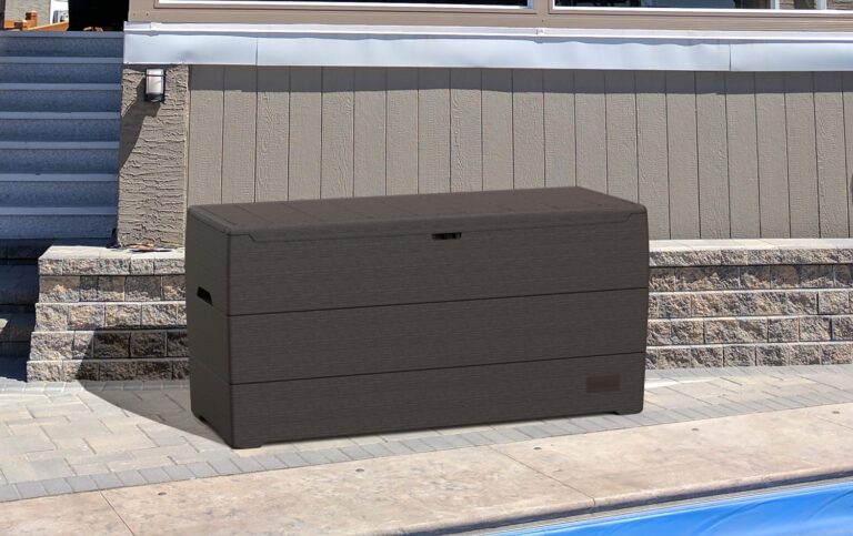 A deck box sitting next to a pool